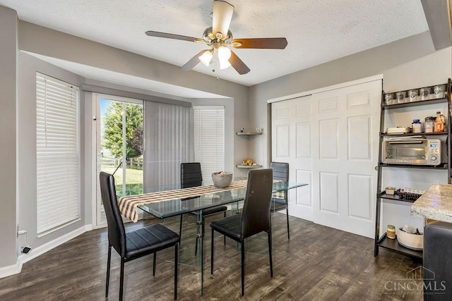 6706 Bedington Ln, Morrow, OH 45152 - dining area featuring dark wood-style floors, ceiling fan, and a textured ceiling