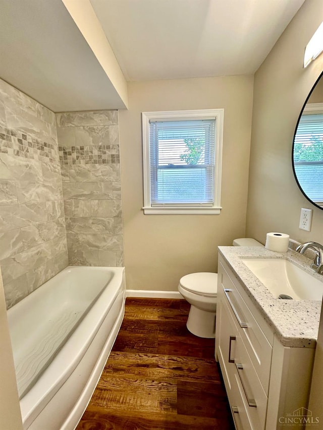 1285 Oakmont Dr, Hamilton, OH 45013 - full bath featuring wood finished floors, vanity, healthy amount of natural light, and  shower combination