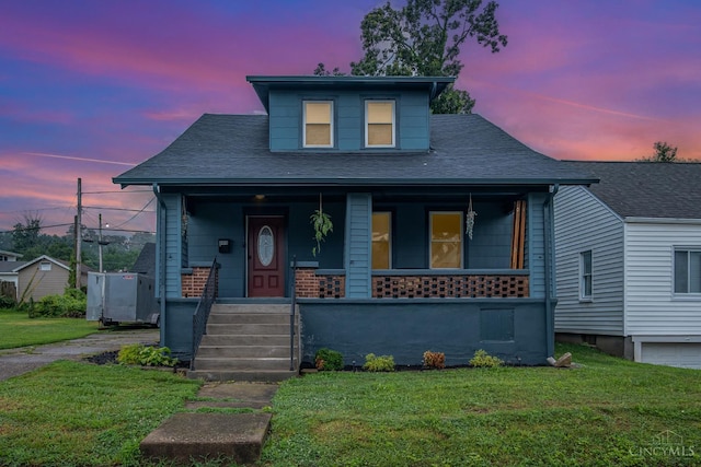 609 Coralie Ave, Hamilton, OH 45013 - bungalow-style home with covered porch, a front yard, and roof with shingles