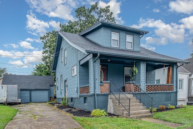 609 Coralie Ave, Hamilton, OH 45013 - view of front of property featuring an outdoor structure, covered porch, a shingled roof, stairs, and a garage