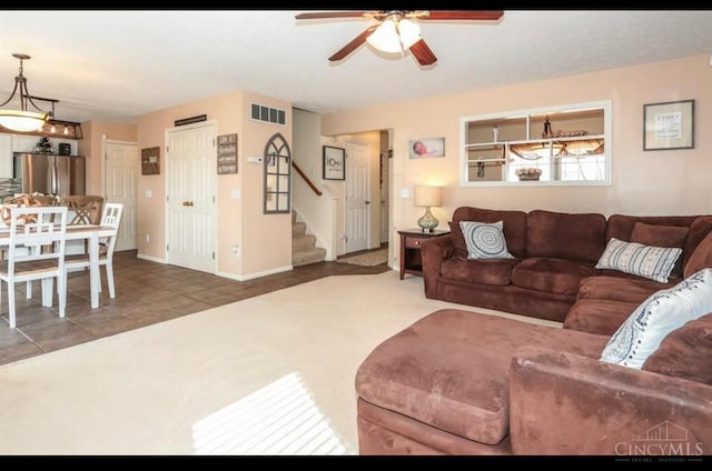 9648 Fallshill Cir, Springfield Twp, OH 45231 - tiled living room with stairway and a ceiling fan
