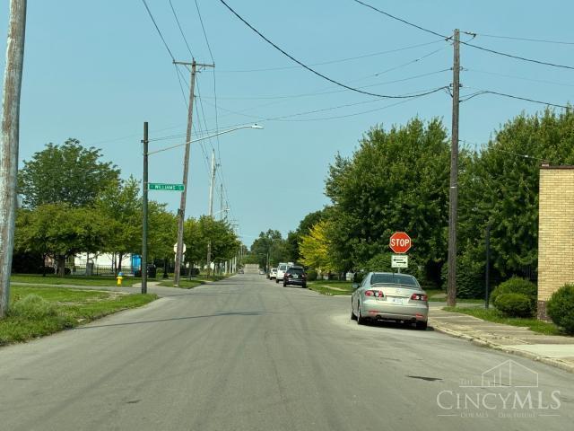 1151 W 2nd St, Dayton, OH 45402 - view of asphalt street featuring street lights, traffic signs, sidewalks, and curbs