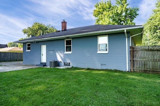 732 Central Ave, Carlisle, OH 45005 - rear view of house featuring a chimney and a patio