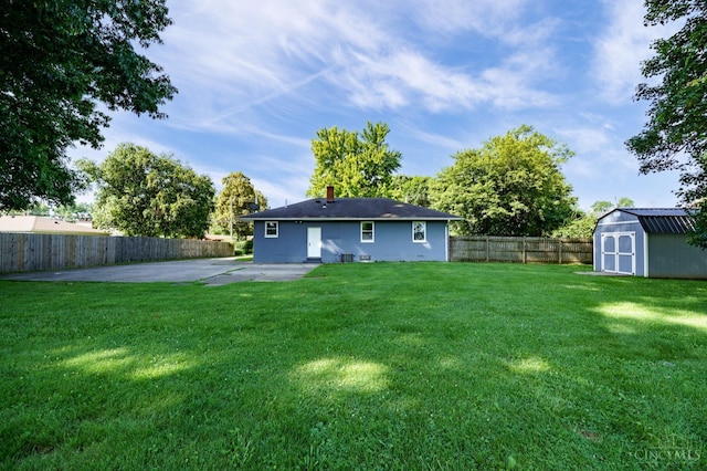 732 Central Ave, Carlisle, OH 45005 - rear view of house featuring a storage unit, a fenced backyard, and a patio
