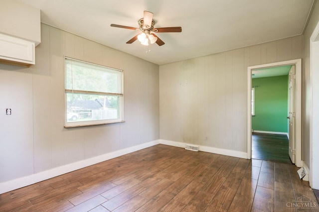 732 Central Ave, Carlisle, OH 45005 - spare room with dark wood finished floors and ceiling fan