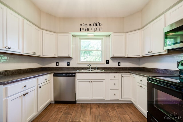 732 Central Ave, Carlisle, OH 45005 - kitchen with appliances with stainless steel finishes, white cabinets, and dark countertops