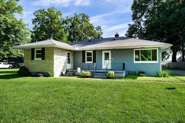 732 Central Ave, Carlisle, OH 45005 - view of front of property with covered porch, stone siding, a front lawn, and a chimney