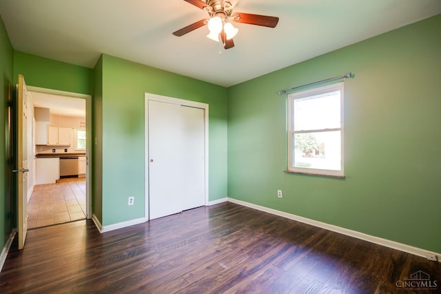 732 Central Ave, Carlisle, OH 45005 - unfurnished bedroom featuring wood finished floors, ceiling fan, and a closet