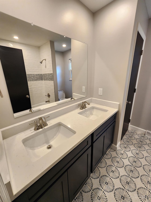 2191 Flomar Ct, Green Twp, OH 45233 - bathroom featuring double vanity, shower / tub combination, tile patterned flooring, and recessed lighting