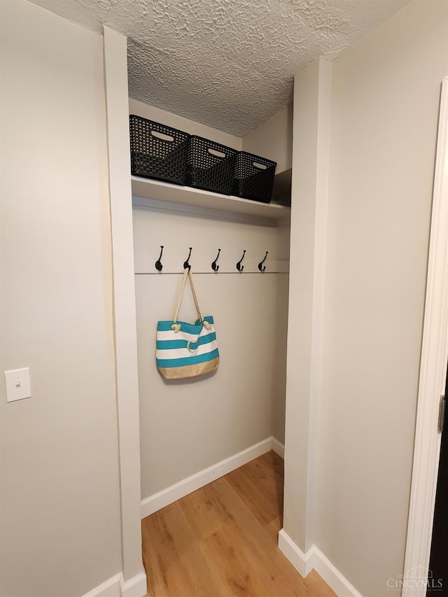 2191 Flomar Ct, Green Twp, OH 45233 - mudroom featuring light wood-style floors and a textured ceiling
