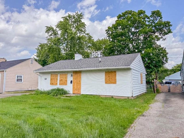 1048 S James Rd, Columbus, OH 43227 - view of front facade featuring a front lawn, a chimney, and driveway