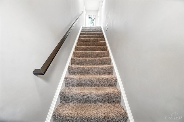 7981 Oakbridge Way, Green Twp, OH 45248 - staircase featuring baseboards
