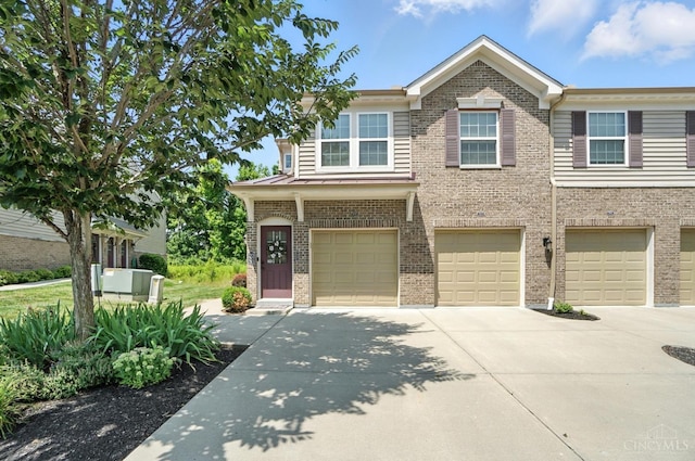 7981 Oakbridge Way, Green Twp, OH 45248 - view of front of home with brick siding, concrete driveway, and a garage