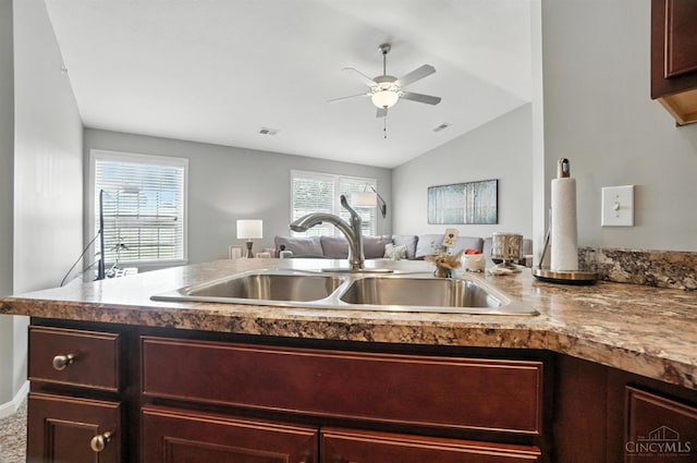 7981 Oakbridge Way, Green Twp, OH 45248 - kitchen featuring ceiling fan, open floor plan, lofted ceiling, and dark brown cabinets