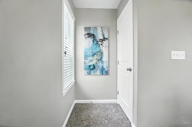 7981 Oakbridge Way, Green Twp, OH 45248 - corridor with baseboards and speckled floor