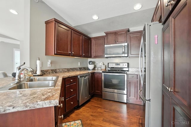 7981 Oakbridge Way, Green Twp, OH 45248 - kitchen featuring appliances with stainless steel finishes, dark wood-style flooring, light countertops, recessed lighting, and lofted ceiling