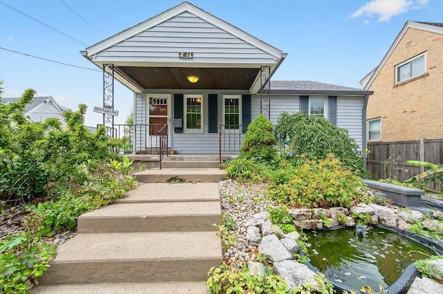 4644 Alpine Ave, Blue Ash, OH 45242 - shotgun-style home featuring a garden pond and a porch