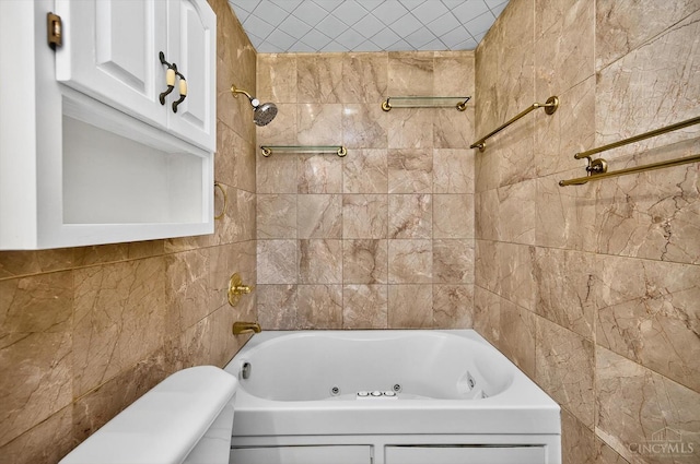 4644 Alpine Ave, Blue Ash, OH 45242 - bathroom with tile walls and a combined bath / shower with jetted tub