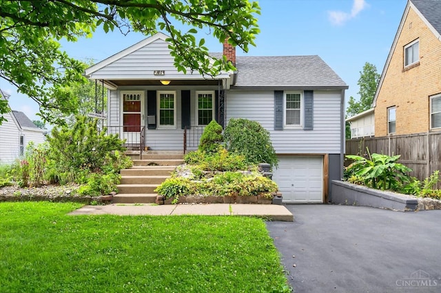 4644 Alpine Ave, Blue Ash, OH 45242 - view of front of home featuring a chimney, covered porch, a garage, driveway, and a shingled roof