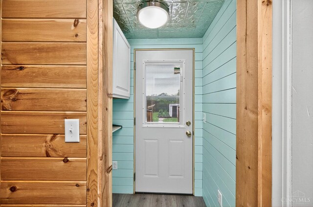 4644 Alpine Ave, Blue Ash, OH 45242 - doorway featuring wood walls, an ornate ceiling, and wood finished floors