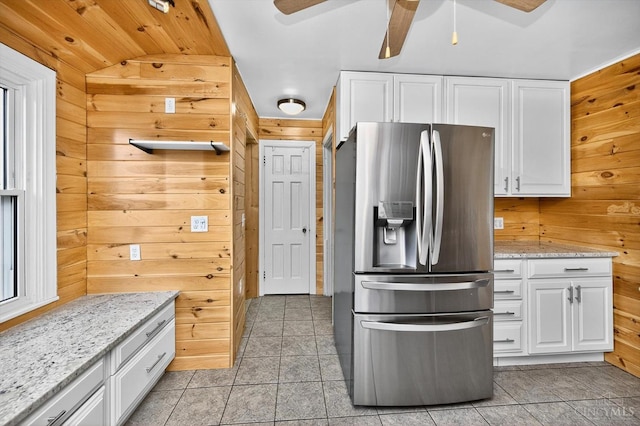 4644 Alpine Ave, Blue Ash, OH 45242 - kitchen featuring stainless steel refrigerator with ice dispenser, wooden walls, white cabinetry, a ceiling fan, and vaulted ceiling