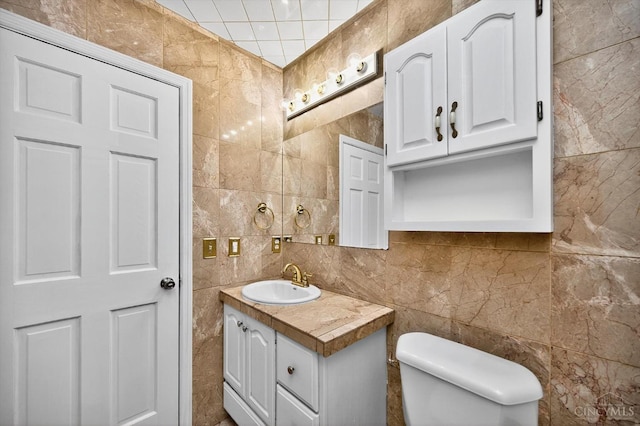 4644 Alpine Ave, Blue Ash, OH 45242 - half bath featuring tile walls, vanity, and decorative backsplash