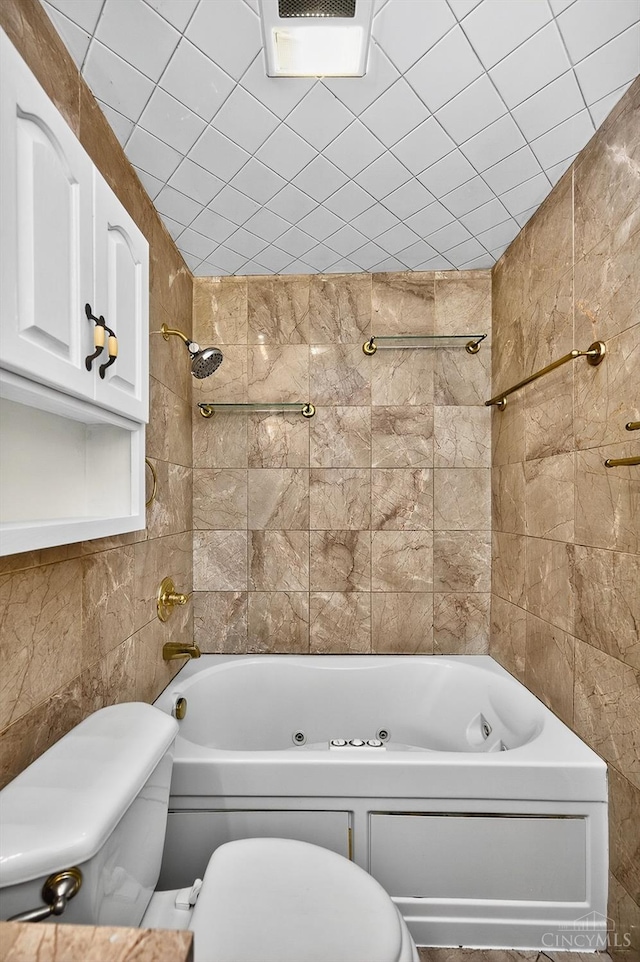 4644 Alpine Ave, Blue Ash, OH 45242 - bathroom featuring tile walls and a combined bath / shower with jetted tub