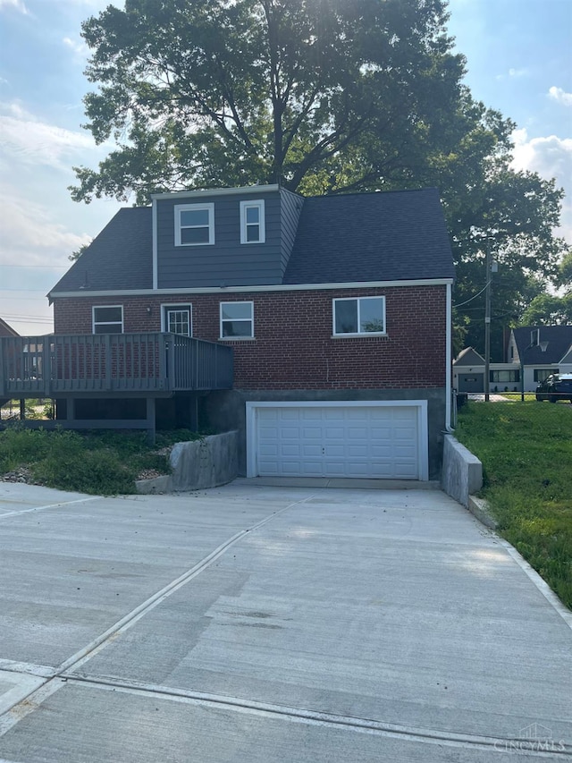 363 Don Ln, Delhi Twp, OH 45238 - view of front facade featuring a garage, concrete driveway, and brick siding