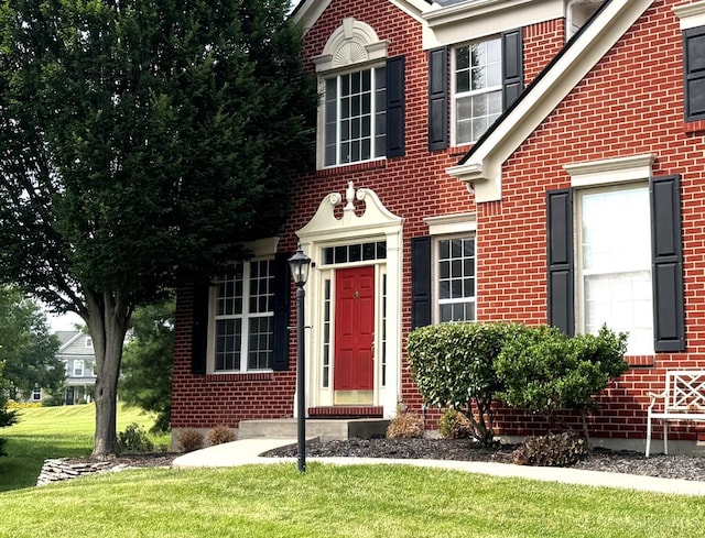 4623 Steeplechase Dr, Batavia Twp, OH 45103 - view of front of home with brick siding and a front lawn