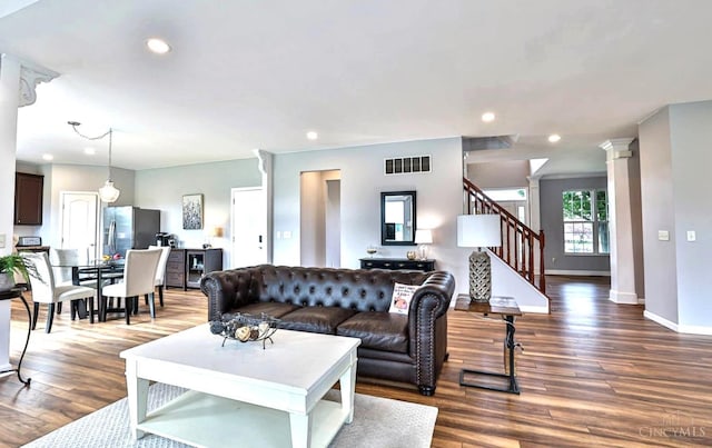 4623 Steeplechase Dr, Batavia Twp, OH 45103 - living room featuring dark wood-style floors, stairs, recessed lighting, and decorative columns