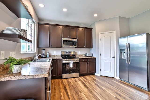 4623 Steeplechase Dr, Batavia Twp, OH 45103 - kitchen with appliances with stainless steel finishes, dark brown cabinetry, light wood-style flooring, recessed lighting, and light countertops