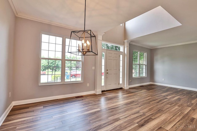 4623 Steeplechase Dr, Batavia Twp, OH 45103 - foyer featuring dark wood-style flooring, a chandelier, crown molding, and ornate columns