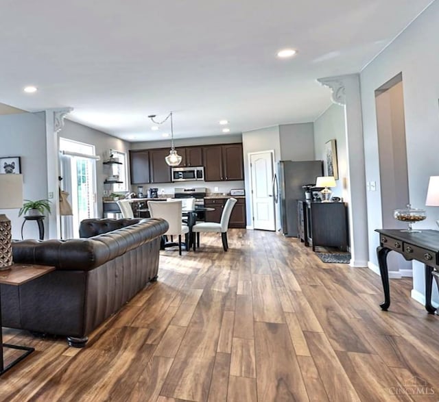 4623 Steeplechase Dr, Batavia Twp, OH 45103 - living area featuring dark wood-type flooring and recessed lighting