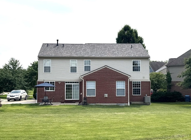 4623 Steeplechase Dr, Batavia Twp, OH 45103 - back of property featuring brick siding and a lawn