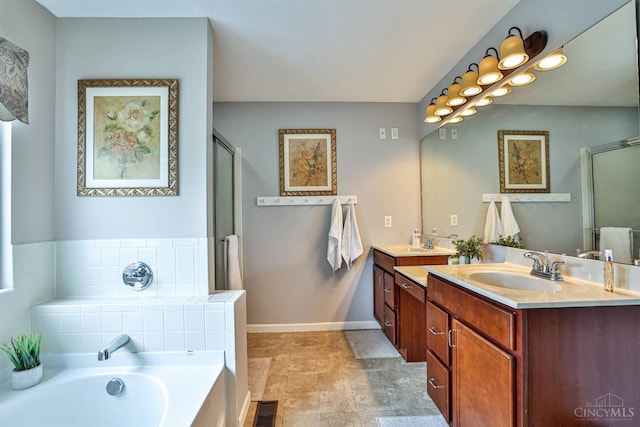 4623 Steeplechase Dr, Batavia Twp, OH 45103 - full bathroom with double vanity, a shower stall, and a garden tub