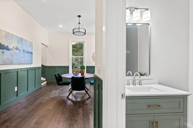 2241 Kemper Ln, Cincinnati, OH 45206 - bathroom featuring wood finished floors, wainscoting, vanity, and recessed lighting