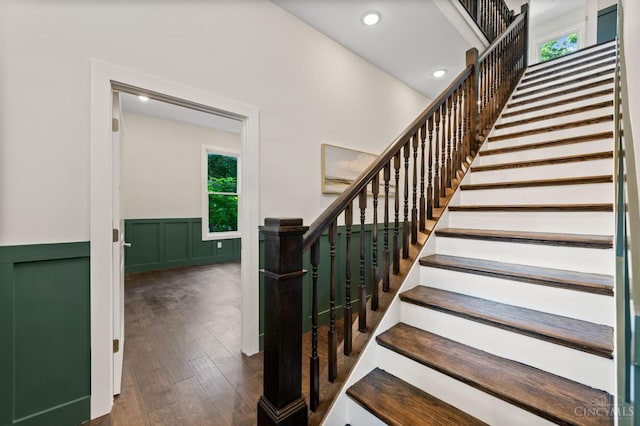 2241 Kemper Ln, Cincinnati, OH 45206 - stairway featuring a wainscoted wall, hardwood / wood-style floors, and recessed lighting