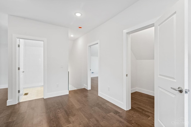 2241 Kemper Ln, Cincinnati, OH 45206 - unfurnished bedroom with a spacious closet, dark wood-style floors, and recessed lighting