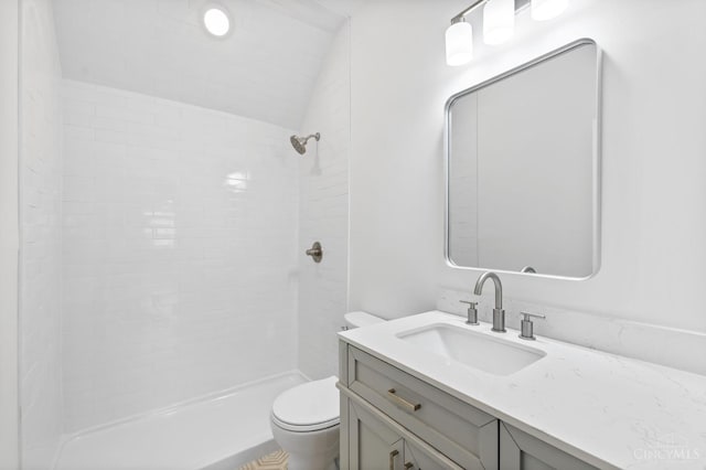 2241 Kemper Ln, Cincinnati, OH 45206 - full bathroom with vanity, vaulted ceiling, and a tile shower