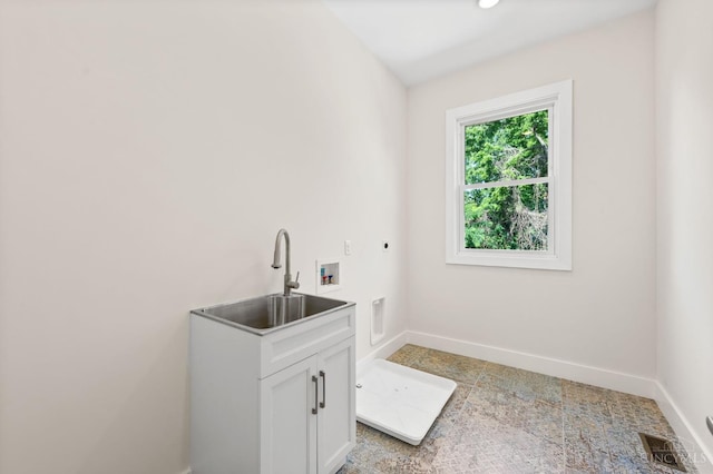 2241 Kemper Ln, Cincinnati, OH 45206 - laundry room featuring hookup for an electric dryer, cabinet space, and hookup for a washing machine