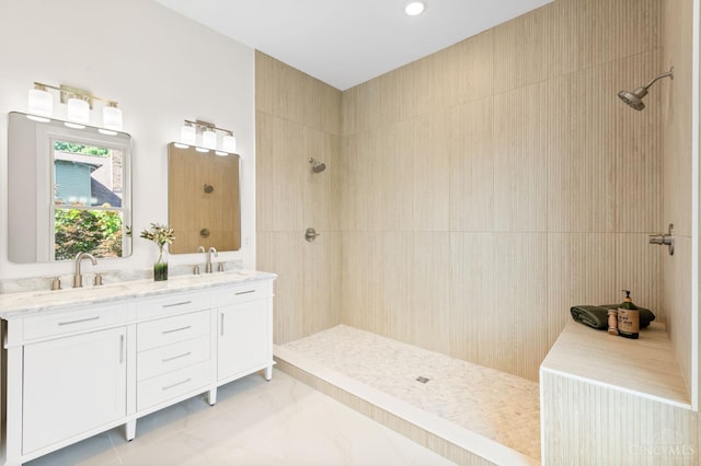 2241 Kemper Ln, Cincinnati, OH 45206 - full bathroom with a tile shower, double vanity, and recessed lighting