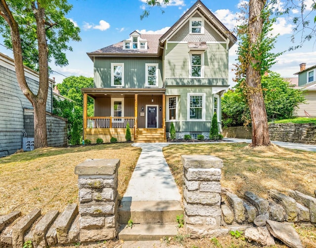 2241 Kemper Ln, Cincinnati, OH 45206 - view of front facade featuring a porch and a shingled roof