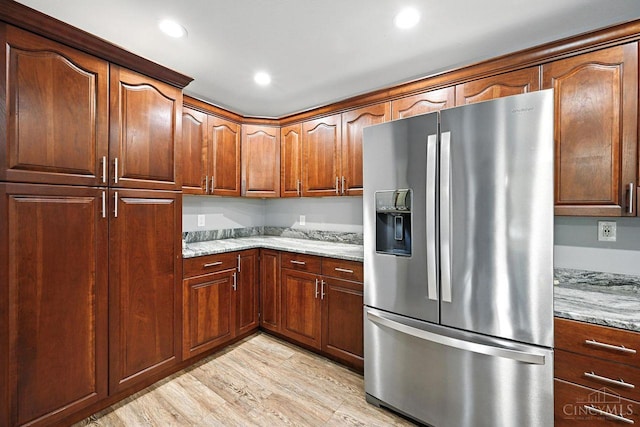11545 Deer Trace Ln, Harrison Twp, OH 45030 - kitchen featuring stainless steel refrigerator with ice dispenser, light stone countertops, light wood-style floors, and recessed lighting