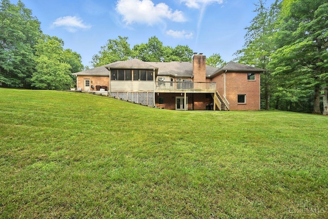 11545 Deer Trace Ln, Harrison Twp, OH 45030 - back of house with a chimney, stairway, a sunroom, a wooden deck, and a yard