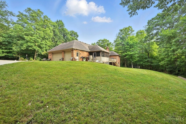 11545 Deer Trace Ln, Harrison Twp, OH 45030 - view of front of house featuring a chimney, a front lawn, a garage, and brick siding