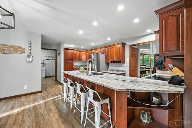 11545 Deer Trace Ln, Harrison Twp, OH 45030 - kitchen featuring open shelves, stainless steel fridge with ice dispenser, recessed lighting, light wood-style floors, and light stone counters