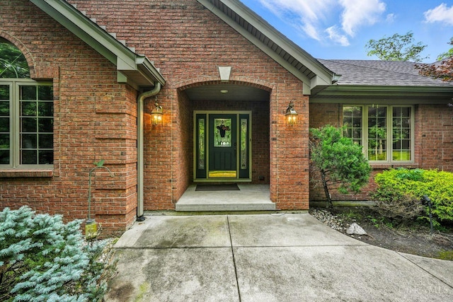 11545 Deer Trace Ln, Harrison Twp, OH 45030 - property entrance with brick siding and roof with shingles