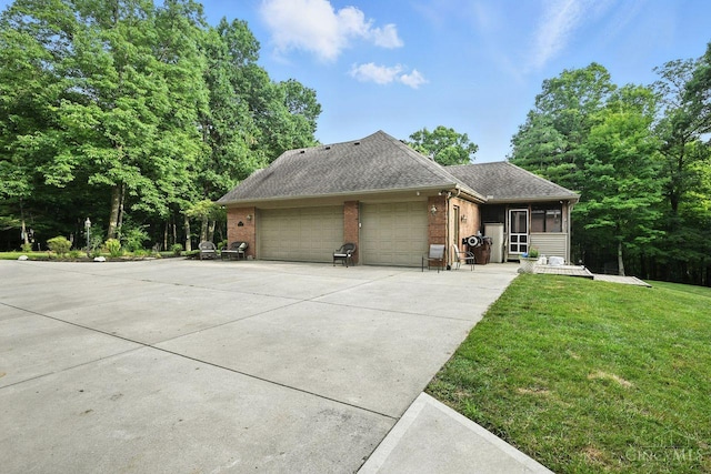 11545 Deer Trace Ln, Harrison Twp, OH 45030 - view of front of property with brick siding, a sunroom, roof with shingles, driveway, and a front lawn