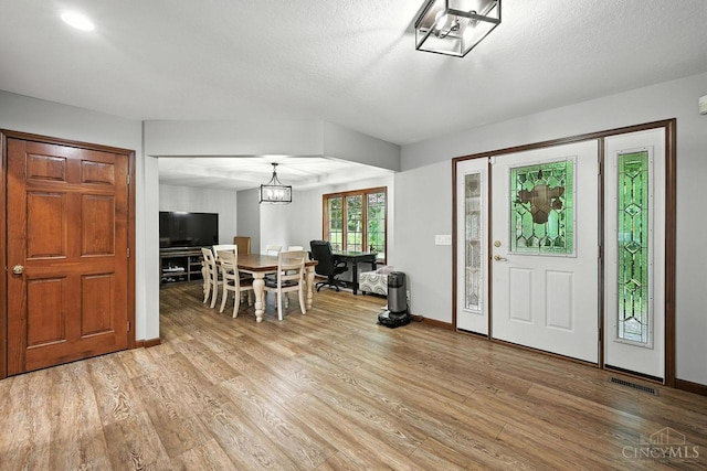 11545 Deer Trace Ln, Harrison Twp, OH 45030 - entryway featuring light wood finished floors and a chandelier