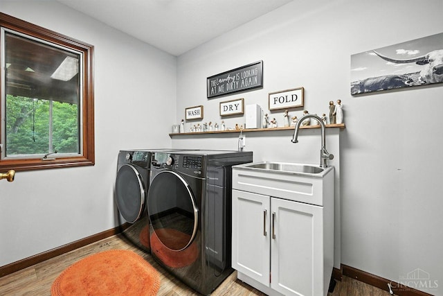 11545 Deer Trace Ln, Harrison Twp, OH 45030 - washroom featuring independent washer and dryer, wet bar, light wood-style flooring, and cabinet space